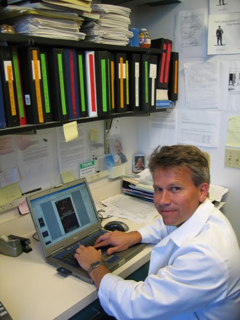 ralph sitting at desk with laptop